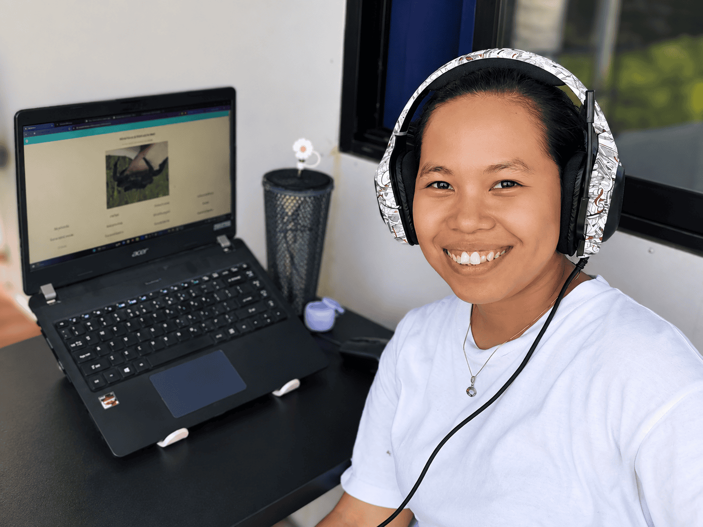 A Connected Women member working on a laptop.